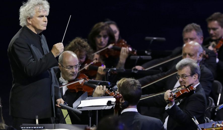 FILE - This is a Friday, July 27, 2012, file photo of Sir Simon Rattle as he conducts an orchestra during the Opening Ceremony at the 2012 Summer Olympics in London. Conductor Simon Rattle is to swap Berlin for Britain, taking over as music director of the London Symphony Orchestra. Rattle, who has led the Berlin Philharmonic since 2002, will join the London ensemble in September 2017. Rattle said Tuesday March 3, 2015 that he would focus on ensuring that as many people as possible have access to classical music. He also hopes to build a new concert hall for the orchestra, which is currently based at London's Barbican Centre.(AP Photo/Mark Humphrey, File)