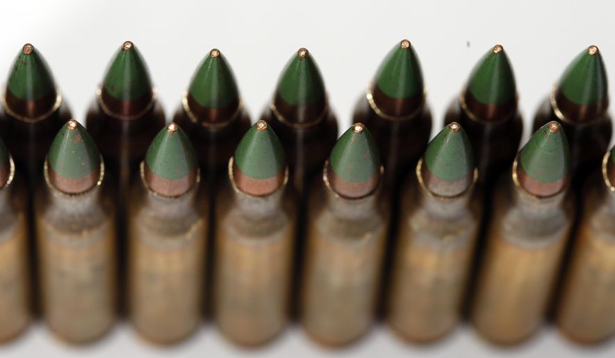 Green tip, M855 5.56mm ammunition is photographed Monday, March 2, 2015, in Fort Washington, Md. (AP Photo/Alex Brandon) ** FILE **
