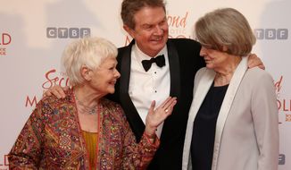 Judi Dench (left) and Maggie Smith joined Director John Madden in London for the world premiere of &quot;The Second Best Exotic Marigold Hotel,&quot; a funny look at old age. (Associated Press)