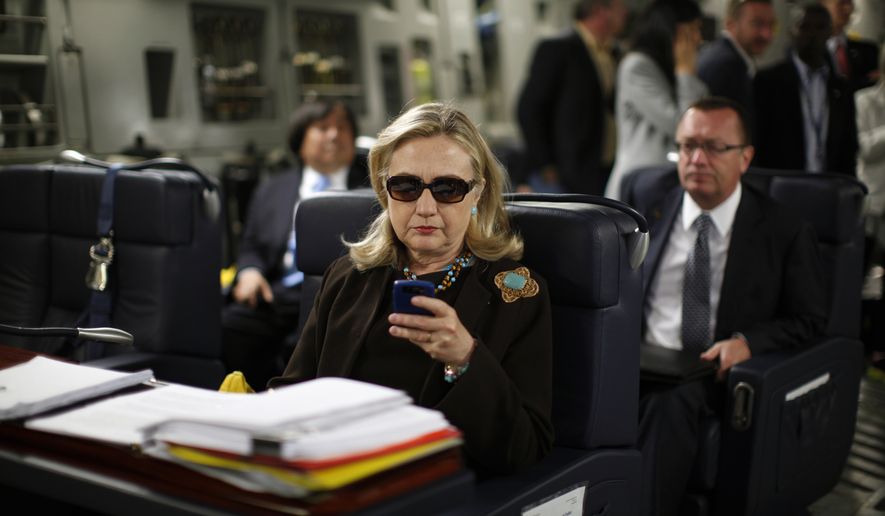 In this Oct. 18, 2011, photo, then-Secretary of State Hillary Rodham Clinton checks her Blackberry from a desk inside a C-17 military plane upon her departure from Malta, in the Mediterranean Sea, bound for Tripoli, Libya. Clinton used a personal email account during her time as secretary of state, rather than a government-issued email address, potentially hampering efforts to archive official government documents required by law. Clinton&#x27;s office said nothing was illegal or improper about her use of the non-government account and that she believed her business emails to State Department and other .gov accounts would be archived in accordance with government rules. (Associated Press) **FILE**
