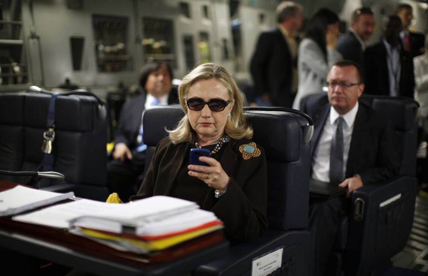 In this Oct. 18, 2011, photo, then-Secretary of State Hillary Rodham Clinton checks her Blackberry from a desk inside a C-17 military plane upon her departure from Malta, in the Mediterranean Sea, bound for Tripoli, Libya. Clinton used a personal email account during her time as secretary of state, rather than a government-issued email address, potentially hampering efforts to archive official government documents required by law. Clinton&#39;s office said nothing was illegal or improper about her use of the non-government account and that she believed her business emails to State Department and other .gov accounts would be archived in accordance with government rules. (Associated Press) **FILE**