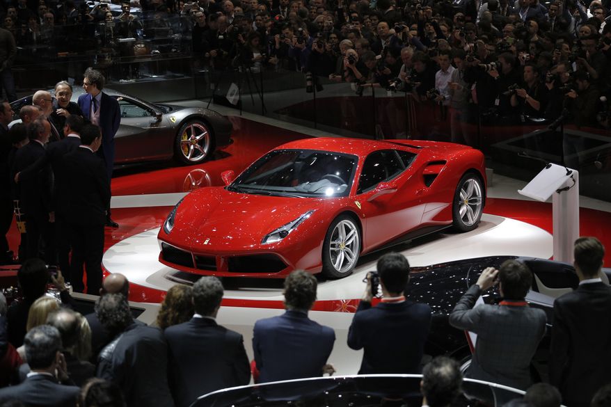 The new Ferrari 488 GTB is presented on the first press day of the Geneva International Motor Show Tuesday, March 3, 2015 in Geneva, Switzerland. The show opens its doors to the public March 5 through March 15.  (AP Photo/Laurent Cipriani)