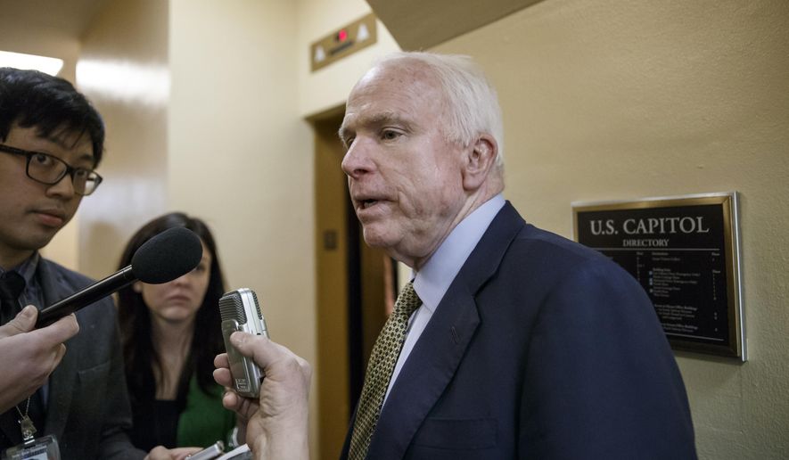 Senate Armed Services Committee Chairman John McCain, R-Ariz., speaks to reporters as he heads to the chamber for a procedural vote at the Capitol in Washington, Monday, March 2, 2015. (AP Photo/J. Scott Applewhite)