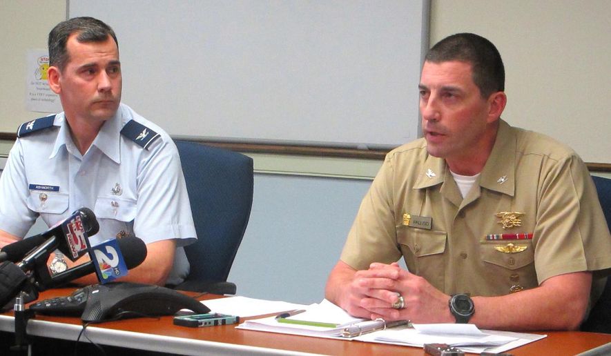 Brett Ashworth, left, vice president for communications and marketing at The Citadel, and Navy Capt. Geno Paluso, the military school's commandant of cadets, appear at a news conference on an investigation into hazing on the campus of the college in Charleston, S.C., on Wednesday, March 4, 2015. (AP Photo/Bruce Smith)
