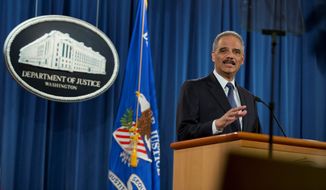 Attorney General Eric H. Holder Jr. speaks Wednesday about the Justice Department&#39;s findings related to two investigations in Ferguson, Missouri. The Justice Department will not prosecute a former police officer involved in a fatal shooting, but the government released a scathing report that faulted the city for racial bias. (Associated Press)
