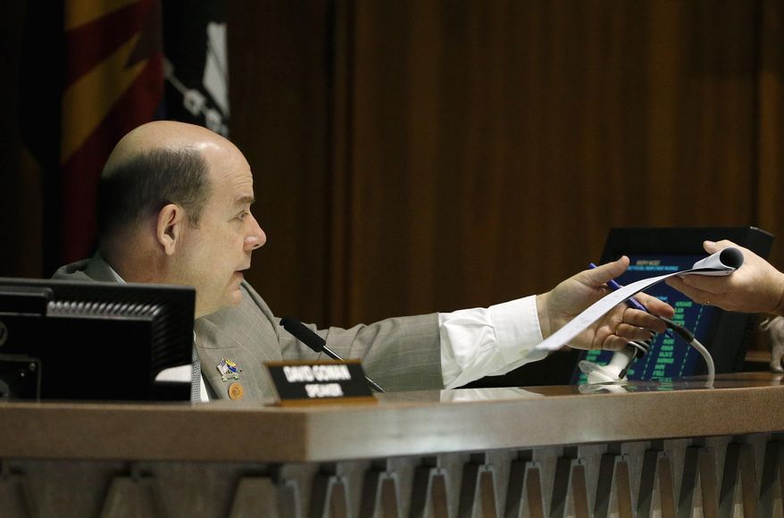 Arizona House Speaker David Gowan conducts legislative business as members debate and vote on bills during session at the Arizona Capitol Wednesday, March 4, 2015, in Phoenix. Gowan and other Republican leaders came to an agreement with Gov. Doug Ducey on a budget plan that cuts more money from universities but gives more to K-12 education. (AP Photo/Ross D. Franklin)