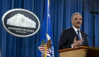 Attorney General Eric Holder speaks at the Justice Department in Washington, Wednesday, March 4, 2015, about the Justice Department&#x27;s findings related to two investigations in Ferguson, Mo. (AP Photo/Carolyn Kaster)