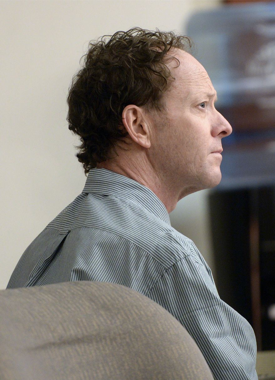 Johnny Brickman Wall listens to testimony during his murder trial, Wednesday, March 4, 2015, in Salt Lake City. Wall, a former Utah pediatrician, is accused of killing his ex-wife, Uta von Schwedler, in 2011. (AP Photo/The Salt Lake Tribune, Al Hartmann, Pool)