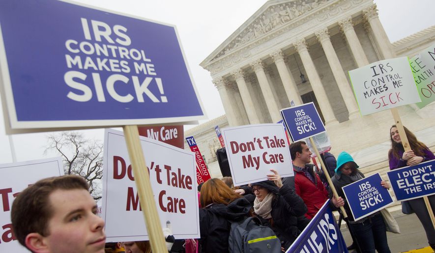 Demonstrators stand outside the Supreme Court in Washington, Wednesday, March 4, 2015, as the court hears arguments in King v. Burwell, a major test of President Barack Obama's health overhaul which, if successful, could halt health care premium subsidies in all the states where the federal government runs the insurance marketplaces. (AP Photo/Pablo Martinez Monsivais)