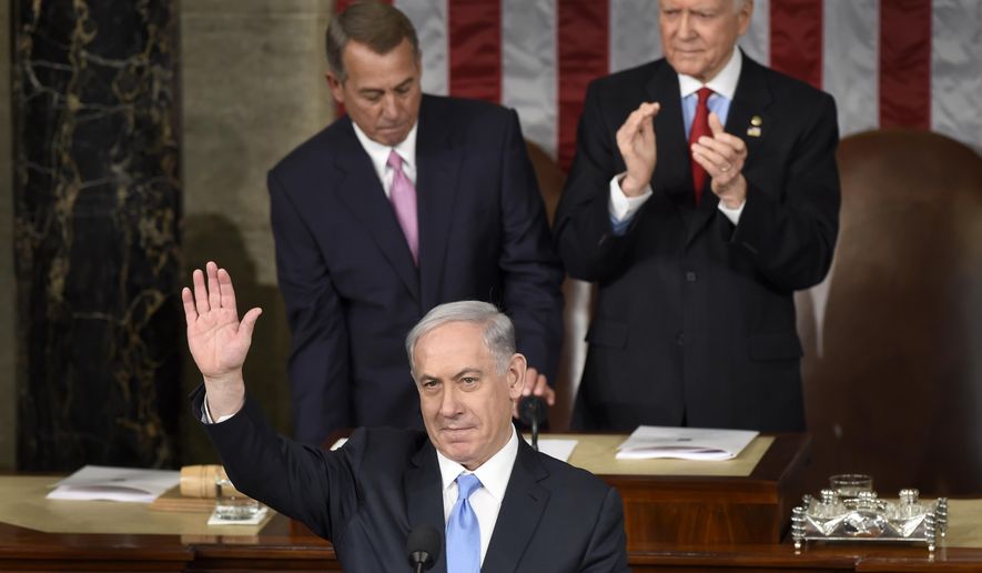Israeli Prime Minister Benjamin Netanyahu waves as he speaks before a joint meeting of Congress on Capitol Hill in Washington, Tuesday, March 3, 2015. (AP Photo/Susan Walsh)