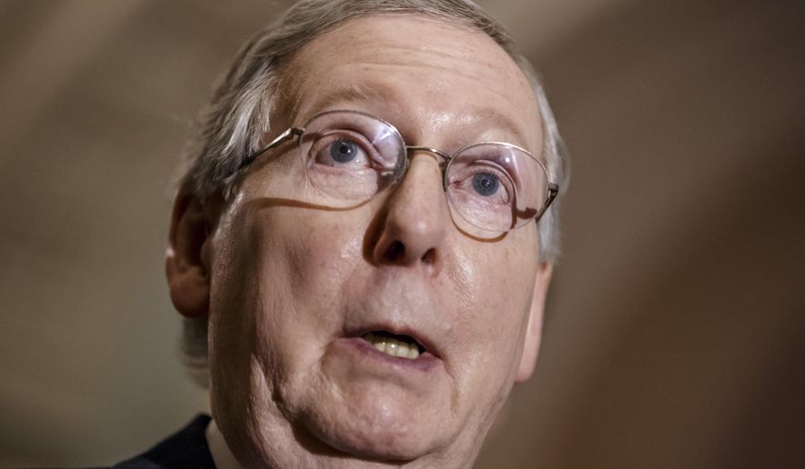 In this March 3, 2015, photo, Senate Majority Leader Mitch McConnell, R-Ky., speaks to the media at the Capitol in Washington. McConnell on Thursday, March 5 decided to postpone action on a bill giving Congress a chance to review and vote on any deal the U.S. inks with Iran over its nuclear program.  (AP Photo/J. Scott Applewhite)