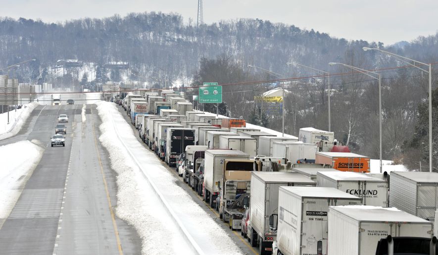 Traffic backs up as more than 50 miles of Interstate 65 southbound is shut down from the weather, Thursday, March 5, 2015, near Mount Washington, Ky. Kentucky State Police reported that the interstate will not reopen until Thursday evening. Kentucky has been walloped by a winter storm that has dumped nearly 2 feet of snow in parts of the state. (AP Photo/Timothy D. Easley)