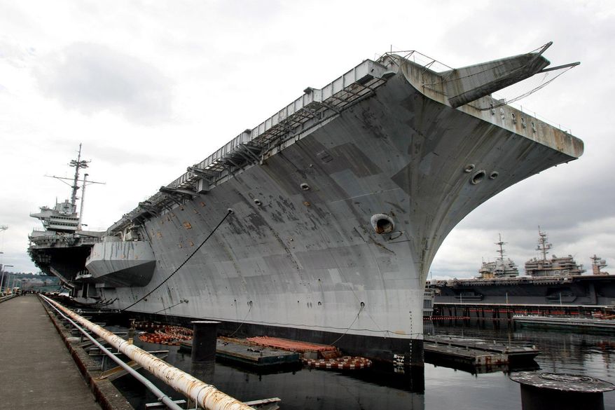 The USS Ranger sits at the dock at the Puget Sound Naval Shipyard in Bremerton, Wash. in this Aug. 14, 2014 photo. The decommissioned carrier will be towed from Bremerton, Wash. to International Shipbreaking Ltd. in Brownsville, Texas on Thursday. (AP Photo/Kitsap Sun, Larry Steagall)
