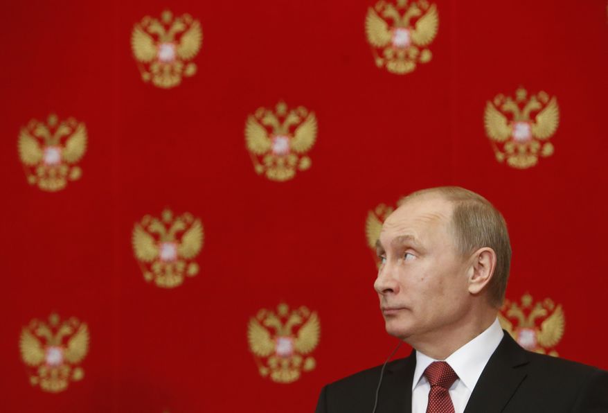 Russian President Vladimir Putin attends a news conference following a meeting with Italian Prime Minister Matteo Renzi in the Kremlin in Moscow, Russia, Thursday, March 5, 2015. (AP Photo/Sergei Karpukhin, Pool)