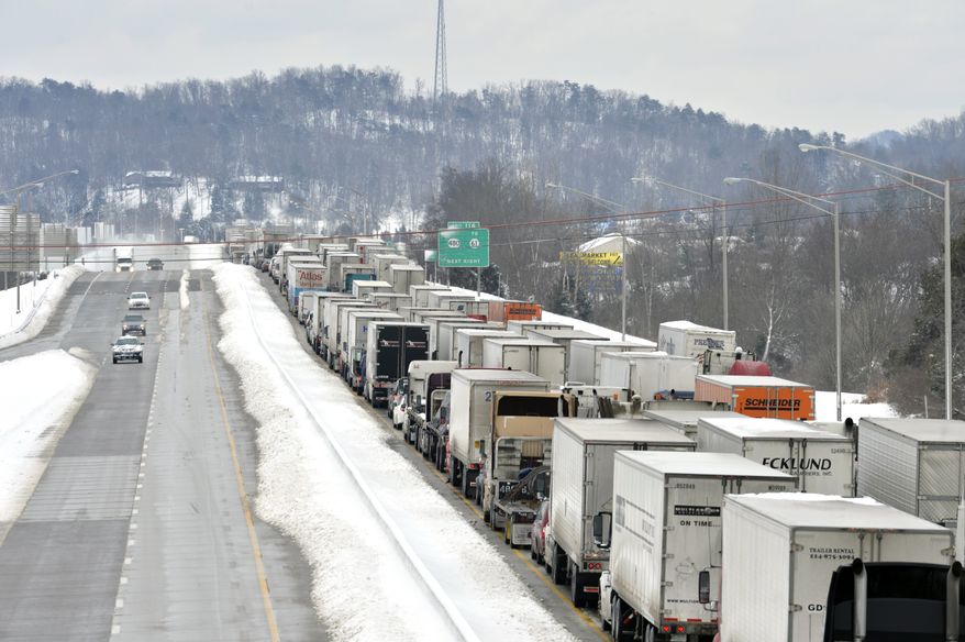 More than 50 miles of Interstate 65 southbound in Kentucky is shut down from the weather, Thursday, March 5, 2015, in Mt. Washington, Ky. Kentucky State Police has reported that the interstate will not reopen for 6-8 hours. Kentucky has been walloped by a winter storm that has dumped nearly two feet of snow in parts of the Bluegrass state. (AP Photo/Timothy D. Easley)