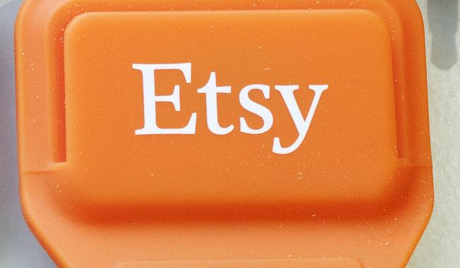 This Tuesday, Jan. 6, 2015, photo shows an Etsy mobile credit card reader, in New York. (AP Photo/Mark Lennihan) **FILE**