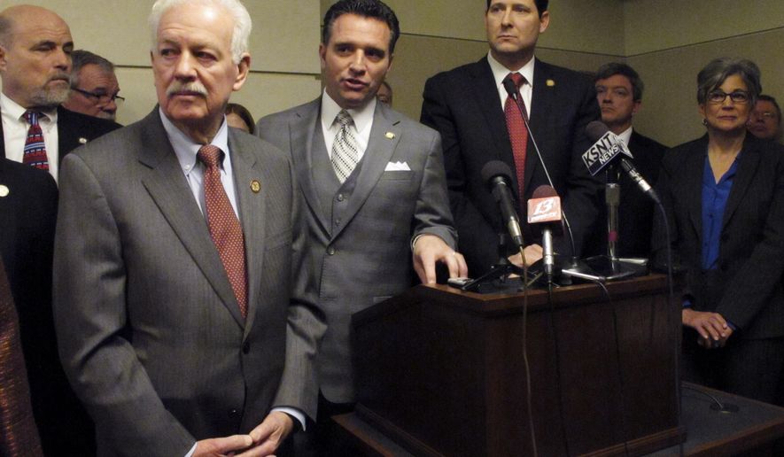 Kansas Senate Ways and Means Committee Chairman Ty Masterson, second from the left, an Andover Republican, discusses a new school funding plan during a news conference Thursday, March 5, 2015, at the Statehouse in Topeka, Kan. To his left is House Speaker Ray Merrick, a Stilwell Republican; to his immediate right is House Appropriations Committee Chairman Ron Ryckman Jr., an Olathe Republican, and to the far right is Senate President Susan Wagle, a Wichita Republican. (AP Photo/John Hanna)