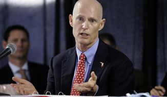 FILE - In this Feb. 5, 2015 file photo, Florida Gov. Rick Scott gestures during a cabinet meeting at the Florida State Fair, in Tampa, Fla. Scott, who has repeatedly tangled with public record advocates, media organizations and others over whether he has followed the state’s transparency law, has insisted did not use private email accounts for state business. (AP Photo/Chris O&#39;Meara, file)