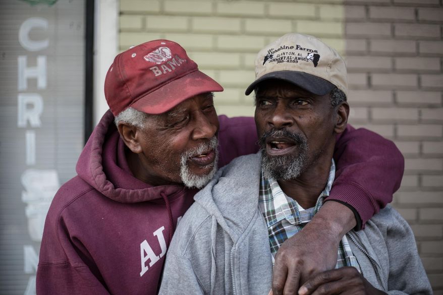 Clarence Nelson Jr., left, teases Johnny Manuel, 66, about his age while talking together along Alabama Avenue on Friday, March 6, 2015, in Selma, Ala. This weekend marks the 50th anniversary of "Bloody Sunday,' a civil rights march in which protestors were beaten, trampled and tear-gassed by police at the Edmund Pettus Bridge, in Selma. (AP Photo/The Casper Star-Tribune, Ryan Dorgan)