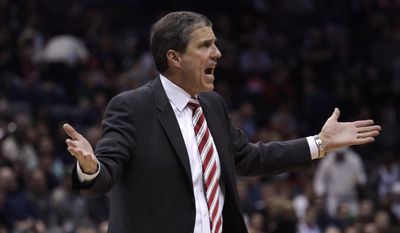 Washington Wizards head coach Randy Wittman reacts during a timeout against the Milwaukee Bucks during the first half of an NBA basketball game Saturday, March 7, 2015, in Milwaukee. (AP Photo/Darren Hauck)