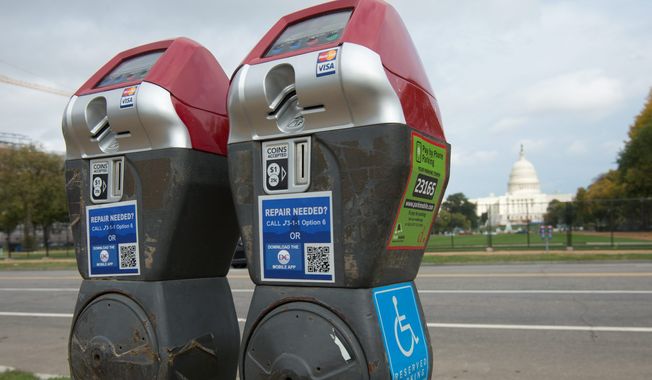 The Accessible Parking Amendment Act of 2012 would involve creating some 1,800 red-top meters such as this that are specifically designated for the disabled, but the devices were installed in such a haphazard manner that incoming transportation officials plan to remove a slew of them before advancing the program. (The Washington Times)