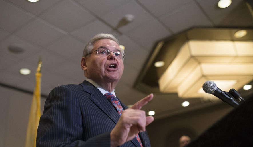 FILE - In this March 6, 2015 file photo, Sen. Bob Menendez, D-N.J. speaks to reporters during a news conference in Newark, N.J. A criminal prosecution of Menendez would represent a major test for a Justice Department anti-corruption unit that recently scored the conviction of a former Virginia governor, but endured humbling setbacks in cases against two former U.S. senators. The New Jersey Democrat is expected to face criminal charges in the coming weeks over his ties to a Florida eye doctor who is also a longtime friend and political donor, a person familiar with the matter told The Associated Press. Menendez denied wrongdoing and said he has served honorably in his more than 20 years in Congress. (AP Photo/John Minchillo, File)