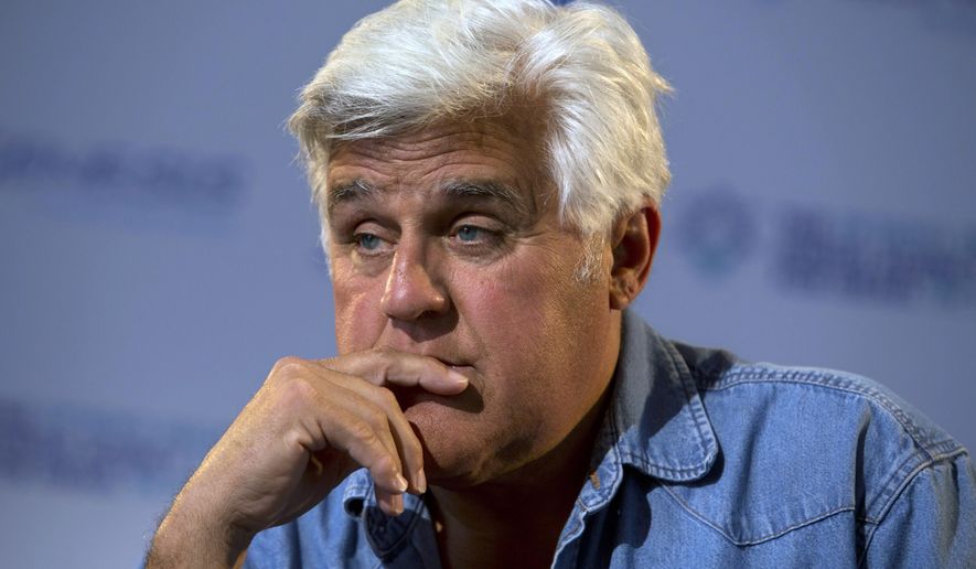 FILE - In this May 21, 2014 file photo, American comedian Jay Leno pauses during an interview with The Associated Press in Jerusalem. Leno says he will return to Israel in June 2015 to host the award ceremony for the second annual &amp;quot;Genesis Prize.&amp;quot;  The $1 million prize is being awarded to actor Michael Douglas in recognition of his support for Jewish causes. (AP Photo/Sebastian Scheiner, File)