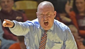 FILE - In this Jan. 3, 2015, file photo, Virginia Tech head coach Buzz Williams yells instructions to his players during the second half of an NCAA college basketball game against Syracuse in Blacksburg, Va. Williams&#x27; first season at Virginia Tech has been perhaps the most difficult of his career. (AP Photo/Don Petersen, File)