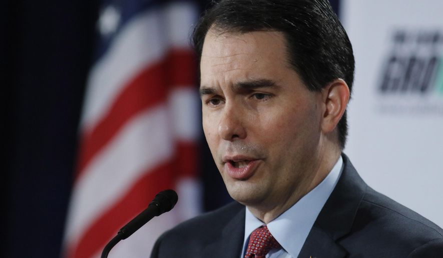 FILE - In this Feb. 28, 2015 file photo, Wisconsin Gov. Scott Walker speaks in Palm Beach, Fla. Republicans lawmakers in statehouses nationwide are working to weaken organized labor, sometimes with efforts that directly shrink union membership. Walker's signing of right-to-work legislation in Wisconsin on Monday puts his defiance of organized labor even more at the center of his nascent presidential campaign. And the inability of unions to exact a price for the first round of legislation targeting them in 2011 is encouraging even more proposals to limit their power. (AP Photo/Joe Skipper, File)