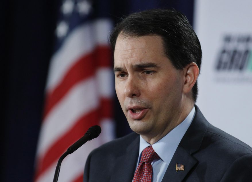 FILE - In this Feb. 28, 2015 file photo, Wisconsin Gov. Scott Walker speaks in Palm Beach, Fla. Republicans lawmakers in statehouses nationwide are working to weaken organized labor, sometimes with efforts that directly shrink union membership. Walker's signing of right-to-work legislation in Wisconsin on Monday puts his defiance of organized labor even more at the center of his nascent presidential campaign. And the inability of unions to exact a price for the first round of legislation targeting them in 2011 is encouraging even more proposals to limit their power. (AP Photo/Joe Skipper, File)