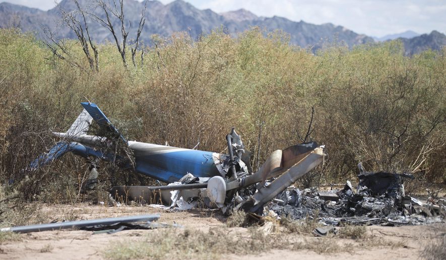 A view of the wreckage of one of two helicopters that apparently collided in midair, near Villa Castelli, in Argentina&#39;s  La Rioja province, Tuesday, March 10, 2015. Two helicopters carrying French sports stars filming a popular European reality show crashed in a remote part of Argentina, killing 10 people, including two Olympic medal winners and a sailing champion, authorities said. (AP Photo/Natacha Pisarenko)