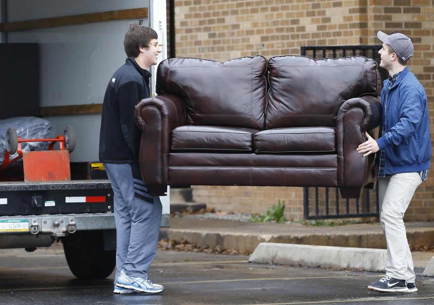 Millennial are moving back in with their parents, but it is not their fault, says William Smith. (AP Photo/Sue Ogrocki)
