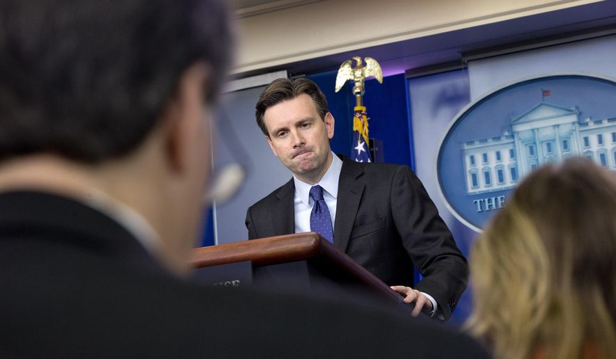 White House press secretary Josh Earnest listens to a question about former Secretary of State Hillary Rodham Clinton&#x27;s emails during his daily news briefing at the White House in Washington, Wednesday, March 11, 2015. Questions ranged from the Islamic State to Mrs. Clinton&#x27;s emails to Ukraine. (AP Photo/Jacquelyn Martin)