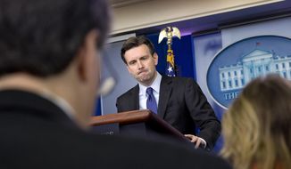 White House press secretary Josh Earnest listens to a question about former Secretary of State Hillary Rodham Clinton&#39;s emails during his daily news briefing at the White House in Washington, Wednesday, March 11, 2015. Questions ranged from the Islamic State to Mrs. Clinton&#39;s emails to Ukraine. (AP Photo/Jacquelyn Martin)
