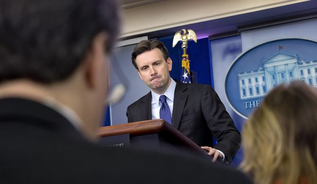 White House press secretary Josh Earnest listens to a question about former Secretary of State Hillary Rodham Clinton&#x27;s emails during his daily news briefing at the White House in Washington, Wednesday, March 11, 2015. Questions ranged from the Islamic State to Mrs. Clinton&#x27;s emails to Ukraine. (AP Photo/Jacquelyn Martin)