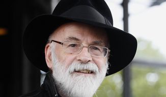 British author Terry Pratchett attends the Conservative party conference in Birmingham, England, in this Tuesday, Oct. 5, 2010, file photo. Pratchett, creator of the “Discworld” series, died Thursday March 12, 2015, at age 66 of a very rare form of early onset Alzheimer&#39;s disease. (AP Photo/Kirsty Wigglesworth, File)