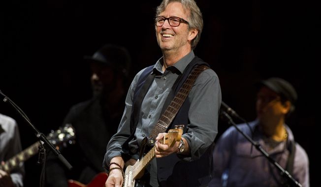 In this April 14, 2013, file photo, Eric Clapton performs at Eric Clapton&#x27;s Crossroads Guitar Festival 2013 at Madison Square Garden in New York. (Photo by Charles Sykes/Invision/AP, File)