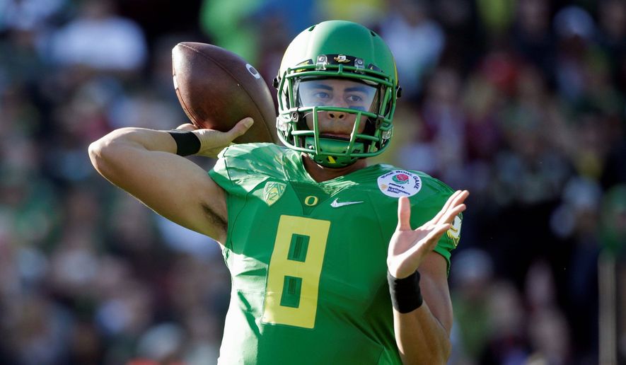Oregon quarterback Marcus Mariota will be taken fifth in the NFL draft by the Redskins, if he falls to them, according to ESPN reporter John Clayton in a recent radio interview. (Associated Press)