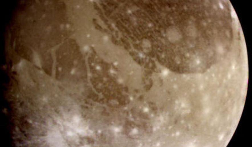 This June 2000 image provided by NASA taken by NASA’s Galileo spacecraft shows Ganymede, Jupiter’s largest moon. Scientists reported Thursday, March 12, 2015 there’s evidence of an ocean beneath the icy surface of Ganymede based on new observations by the Hubble Space Telescope. (AP Photo/NASA)