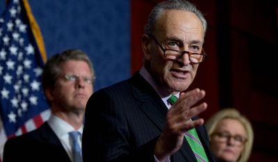 Sen. Chuck Schumer, New York Democrat (center) — flanked by Office of Management and Budget Director Shaun Donovan and Sen. Claire McCaskill, Missouri Democrat — urged Congressional Republicans to support sequestration relief in the upcoming budget on Thursday during a news conference on Capitol Hill. (Associated Press)