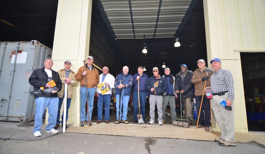 A group of men know as the Kingsport Regulars pose outside there storage building in Kingsport, Tenn, March 20, 2013. The get together and help build houses for low-income families L to R: Jim Boushley, Doyle Alley, John Peters, Geoff Dougal, Charles Barrett, Gordon Travis, Dick Orr, J.J., John Harrison, Chuck Smith and Al Miller . (AP Photo/Kingsport Times News, David Grace)