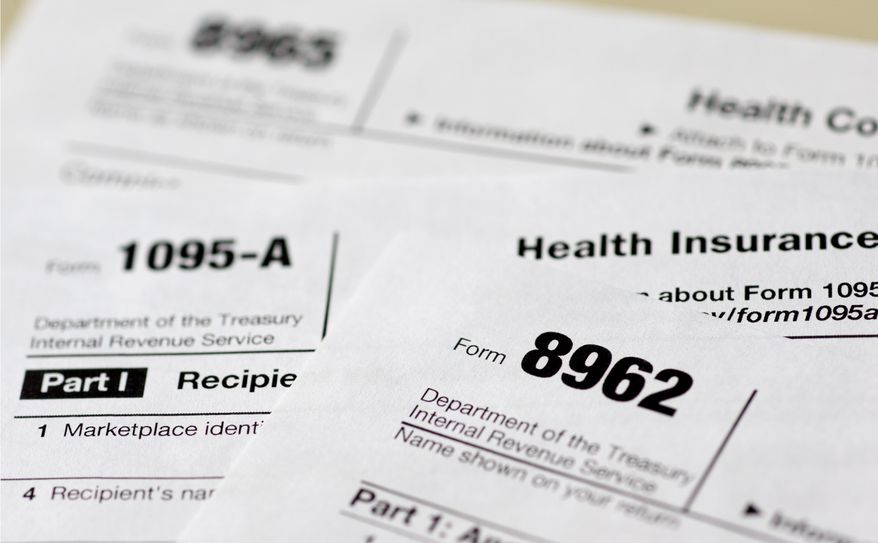FILE - This Aug. 21, 2014, file photo shows health care tax forms 8962, 1095-A, and 8965, in Washington. Several million people hit with new federal fines for going without health insurance will get a second chance to sign up starting Sunday, March 15, 2015, and that could ease the sting of rising penalties for being uninsured. (AP Photo/Carolyn Kaster, File)