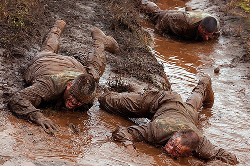 1-27 Infantry Battalion 2nd Brigade, 25th Infantry Division soldiers low crawl during training at Schofield Barracks, Hawaii Feb. 4, 2008. (U.S. Army)
