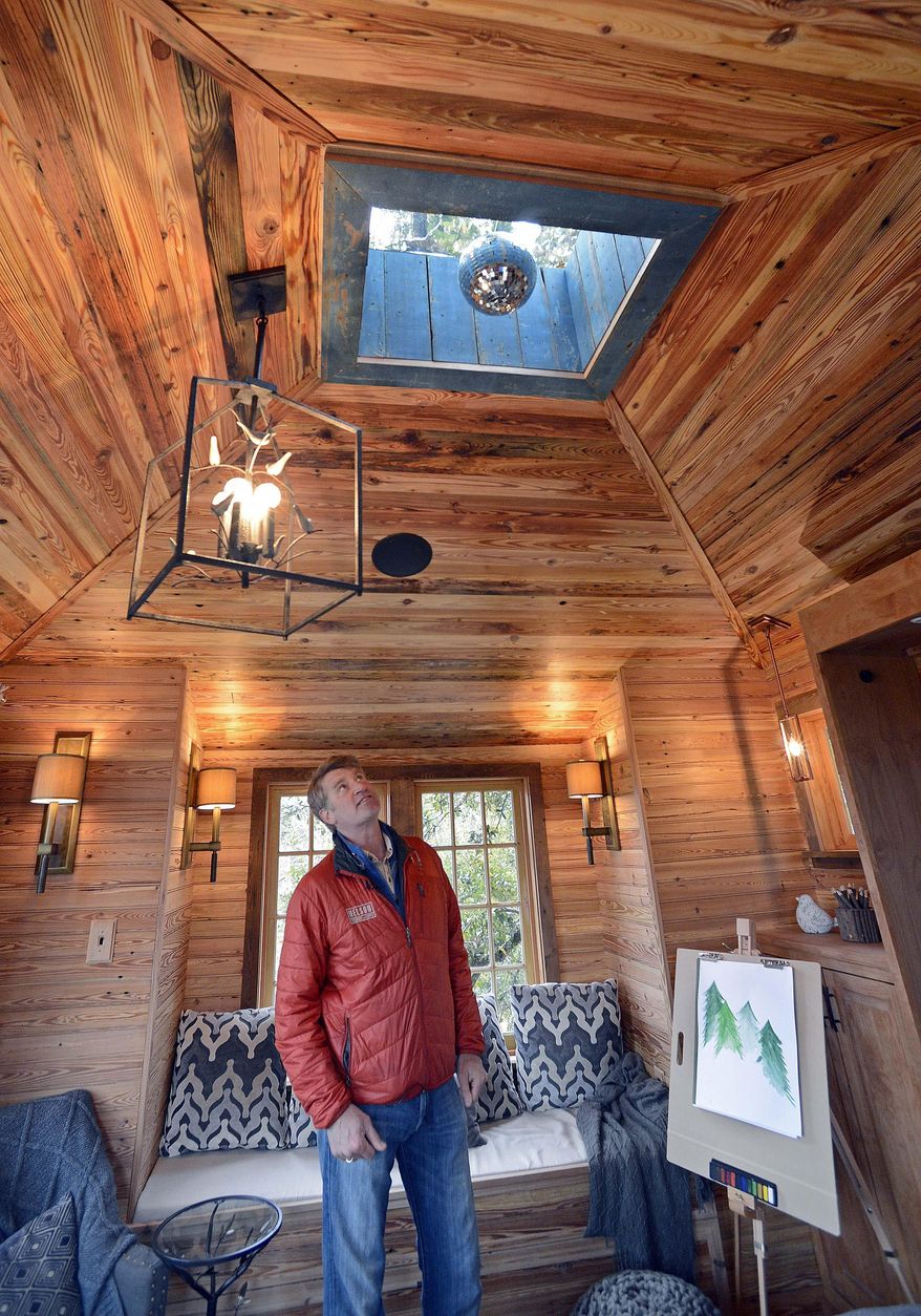 The Animal Planet show "Treehouse Masters" host Pete Nelson talks about the disco ball in the bedroom on the second level of the treehouse that was built on Todd and Gwen Graves' property on Feb. 23, 2015 in Baton Rouge, La. The treehouse is the show's first in Louisiana and also its largest. (AP Photo/The Baton Rouge Advocate,Bill Feig)