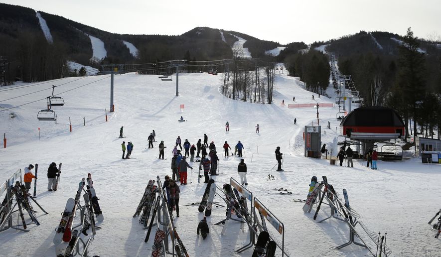 Skiers congregate at the base of a run at Sunday River ski resort, Friday, March, 13, 2015 in Newry, Maine. CNL Resort Properties , the real estate investment trust that's the largest owner of ski areas in the country, including Sunday River, is quietly putting the entire lot, along with dozens of other properties , up for sale. The company is looking to liquidate to repay investors. (AP Photo/Robert F. Bukaty)