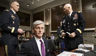 Secretary of the Army John M. McHugh, flanked by Army Chief of Staff Gen Raymond Odierno, right, and Maj. Gen. William E. Rapp, the Army legislative liaison, arrives to update members of the Senate Armed Services Committee about the deadly shooting rampage by a soldier yesterday at Fort Hood in Texas, on Capitol Hill in Washington, Thursday, April 3, 2014. An Iraq War veteran being treated for mental illness was the gunman who opened fire at Fort Hood, killing three people and wounding 16 others before committing suicide, in an attack on the same Texas military base where more than a dozen people were slain in 2009.   (AP Photo/J. Scott Applewhite)