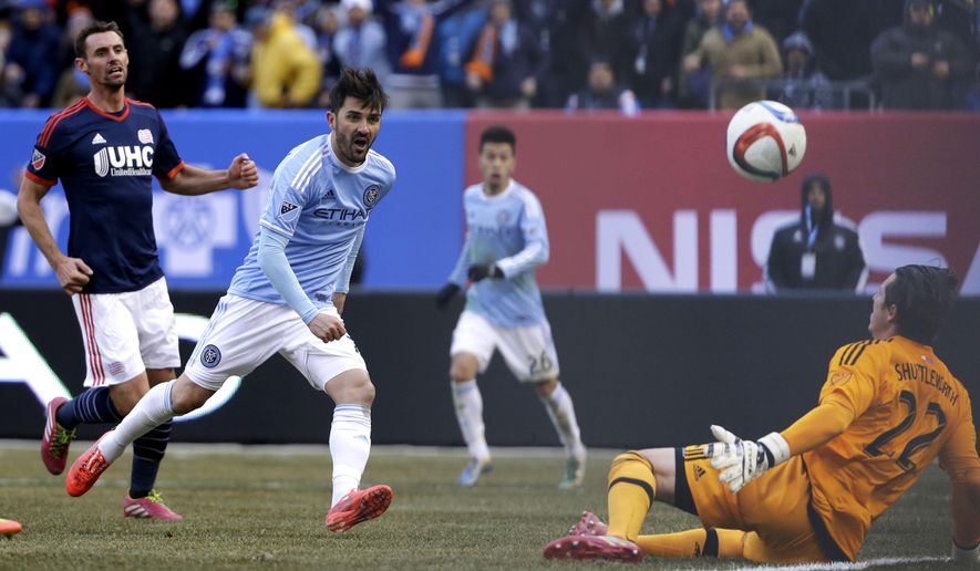 New York City FC&#39;s David Villa, second from left, scores past New England Revolution goalkeeper Bobby Shuttleworth, right, during the first half of an MLS soccer game at Yankee Stadium in New York, Sunday, March 15, 2015. (AP Photo/Seth Wenig)