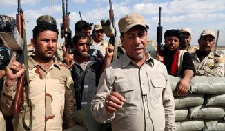 The offensive to retake Saddam Hussein&#39;s hometown of Tikrit from Islamic State jihadis is being closely monitored by those in nearby Mosul, as Tikrit&#39;s fate may determine Mosul&#39;s destiny as well. (Associated Press)