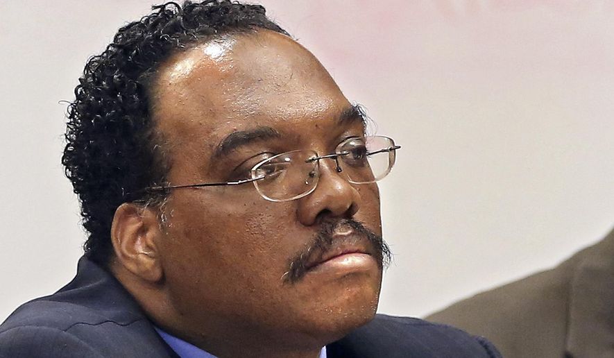 FILE - In this Aug. 21, 2014 file photo, Cuyahoga County Common Pleas Judge Lance Mason listens during a hearing in Cleveland. The Ohio Supreme Court ruled Tuesday, March 17, 2015, the trial of Mason, accused of assaulting his estranged wife, can go forward. Forty-seven-year-old Mason is charged with felonious assault, kidnapping and child endangering for what authorities say was a violent attack on Aisha Mason on Aug 2. (AP Photo/The Plain Dealer, Chuck Crow, File)