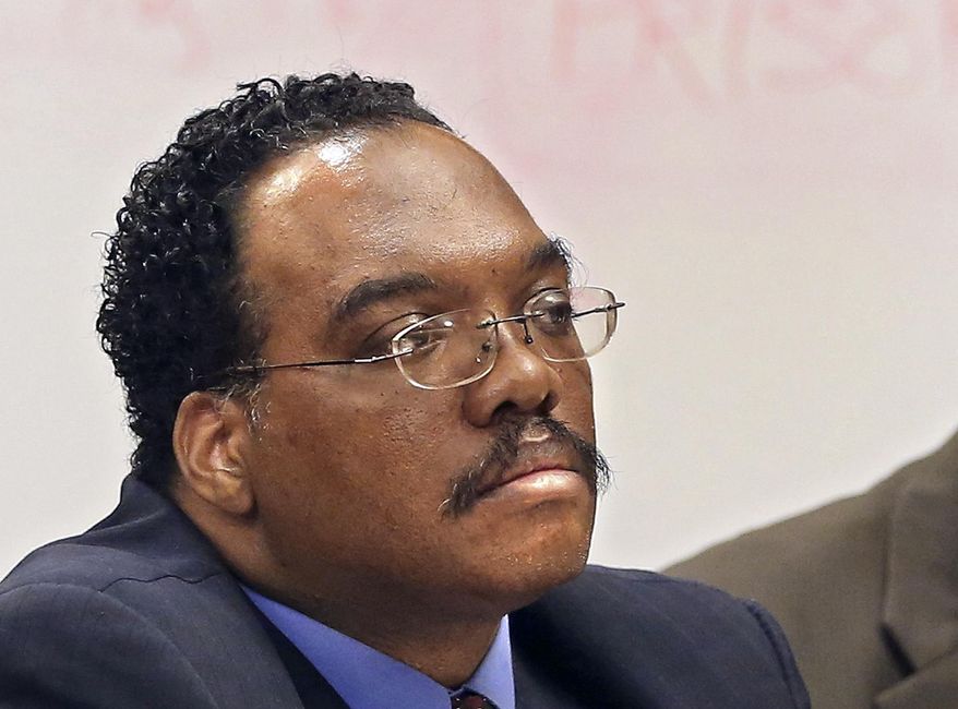 FILE - In this Aug. 21, 2014 file photo, Cuyahoga County Common Pleas Judge Lance Mason listens during a hearing in Cleveland. The Ohio Supreme Court ruled Tuesday, March 17, 2015, the trial of Mason, accused of assaulting his estranged wife, can go forward. Forty-seven-year-old Mason is charged with felonious assault, kidnapping and child endangering for what authorities say was a violent attack on Aisha Mason on Aug 2. (AP Photo/The Plain Dealer, Chuck Crow, File)